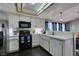 Kitchen with stainless steel appliances and white cabinets at 4421 Rodman Dr, Las Vegas, NV 89130