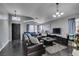 Bright living room with dark hardwood floors and a view of the front door at 4421 Rodman Dr, Las Vegas, NV 89130