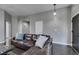 Living room with sectional sofa, dark hardwood floors, and a Christmas tree at 4421 Rodman Dr, Las Vegas, NV 89130