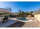 Inviting backyard oasis with a sparkling pool and rock waterfall at 4421 Rodman Dr, Las Vegas, NV 89130