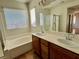 Double sink bathroom with bathtub and shower at 4520 Lemon Gems Ct, Las Vegas, NV 89130