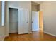 Bright bedroom with wood floors and mirrored closet doors at 4520 Lemon Gems Ct, Las Vegas, NV 89130