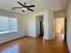 Hardwood floor bedroom with ceiling fan and walk-in closet at 4520 Lemon Gems Ct, Las Vegas, NV 89130