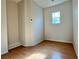 Small bedroom with wood floors and a window at 4520 Lemon Gems Ct, Las Vegas, NV 89130