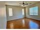 Bright bedroom with hardwood floors and ceiling fan at 4520 Lemon Gems Ct, Las Vegas, NV 89130