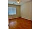 Hardwood floor bedroom with ceiling fan and window at 4520 Lemon Gems Ct, Las Vegas, NV 89130