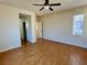 Spacious bedroom with hardwood floors and ceiling fan at 4520 Lemon Gems Ct, Las Vegas, NV 89130