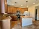 Kitchen with wood cabinets and granite countertops at 4520 Lemon Gems Ct, Las Vegas, NV 89130