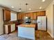 Kitchen with wood cabinets and granite countertops at 4520 Lemon Gems Ct, Las Vegas, NV 89130