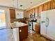 Kitchen with wood cabinets and granite countertops at 4520 Lemon Gems Ct, Las Vegas, NV 89130