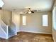 Bright living room with tile floors and stairway at 4520 Lemon Gems Ct, Las Vegas, NV 89130