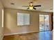 Living room with tile floors and sliding glass door at 4520 Lemon Gems Ct, Las Vegas, NV 89130