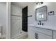 Modern bathroom with marble and black tile shower at 4962 E Baltimore Ave, Las Vegas, NV 89104