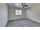 Well-lit bedroom with ceiling fan and carpet flooring at 4962 E Baltimore Ave, Las Vegas, NV 89104