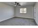 Bright bedroom with ceiling fan and grey carpet at 4962 E Baltimore Ave, Las Vegas, NV 89104