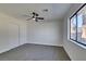 Bedroom with ceiling fan and grey carpet at 4962 E Baltimore Ave, Las Vegas, NV 89104