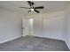 Spacious bedroom with ceiling fan and grey carpet at 4962 E Baltimore Ave, Las Vegas, NV 89104