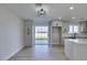 Dining area with sliding door to backyard and modern light fixture at 4962 E Baltimore Ave, Las Vegas, NV 89104