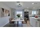 Bright dining area with marble table and access to the backyard at 4962 E Baltimore Ave, Las Vegas, NV 89104