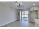 Dining area with hardwood floors and sliding door to backyard at 4962 E Baltimore Ave, Las Vegas, NV 89104