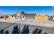 Single story home with gray exterior, wood fence and driveway at 4962 E Baltimore Ave, Las Vegas, NV 89104