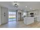 Modern kitchen with island, gray cabinets, and stainless steel appliances at 4962 E Baltimore Ave, Las Vegas, NV 89104