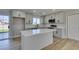 Renovated kitchen featuring an island, gray cabinets, and wood-look flooring at 4962 E Baltimore Ave, Las Vegas, NV 89104