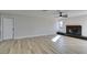 Living room with fireplace, ceiling fan and light wood flooring at 4962 E Baltimore Ave, Las Vegas, NV 89104