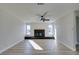 Living room with fireplace, ceiling fan and light wood flooring at 4962 E Baltimore Ave, Las Vegas, NV 89104