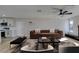 Virtually staged living room with a brown sofa and coffee table at 4962 E Baltimore Ave, Las Vegas, NV 89104