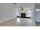 Living room with fireplace, ceiling fan and light wood flooring at 4962 E Baltimore Ave, Las Vegas, NV 89104