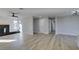 Bright living room with fireplace and wood-look flooring at 4962 E Baltimore Ave, Las Vegas, NV 89104