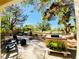 Charming backyard patio featuring a built-in grill, seating, and views of the lush green space beyond at 5381 Waving Sage Dr, Las Vegas, NV 89149