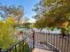 Backyard featuring an iron railing fence and views of the mature trees and garden at 5381 Waving Sage Dr, Las Vegas, NV 89149