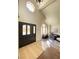 Welcoming entryway with decorative stained-glass door and high ceilings leading into a spacious living area at 5381 Waving Sage Dr, Las Vegas, NV 89149