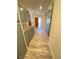 Bright hallway features wood-style flooring, gray cabinets, and an open view at 5381 Waving Sage Dr, Las Vegas, NV 89149