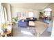 Bright living room featuring modern furniture, large windows, and a separate dining area at 5381 Waving Sage Dr, Las Vegas, NV 89149