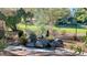 Relaxing backyard water feature with stone accents and lush landscaping creating a serene outdoor escape at 5381 Waving Sage Dr, Las Vegas, NV 89149