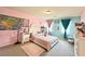 Bright bedroom with pink walls, a queen bed, and decorative elements at 6454 Mount Palomar Ave, Las Vegas, NV 89139