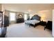 Main bedroom with large bed, ample space, and ensuite access at 6454 Mount Palomar Ave, Las Vegas, NV 89139