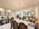 Bright dining room features a formal dining set and views into the living room at 6454 Mount Palomar Ave, Las Vegas, NV 89139