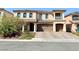 Two-story house with a brick driveway and landscaped front yard at 6454 Mount Palomar Ave, Las Vegas, NV 89139