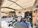 Garage with epoxy flooring, home gym equipment, and storage at 6454 Mount Palomar Ave, Las Vegas, NV 89139