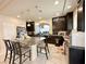 Modern kitchen with dark cabinetry, granite countertops, and an island at 6454 Mount Palomar Ave, Las Vegas, NV 89139