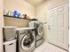 Convenient laundry room with washer, dryer, and additional shelving at 6454 Mount Palomar Ave, Las Vegas, NV 89139