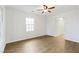 Bright bedroom with wood-look floors and ceiling fan at 659 I, Boulder City, NV 89005