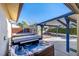 Relax in this hot tub with covered patio and spacious backyard at 659 I, Boulder City, NV 89005