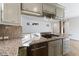 Modern kitchen with granite countertops and stainless steel dishwasher at 659 I, Boulder City, NV 89005