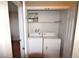 Bright laundry room, featuring washer and dryer, and ample shelf space at 6955 N Durango Dr # 1085, Las Vegas, NV 89149