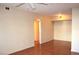 Living room with hardwood floors and access to hallway at 6955 N Durango Dr # 1085, Las Vegas, NV 89149